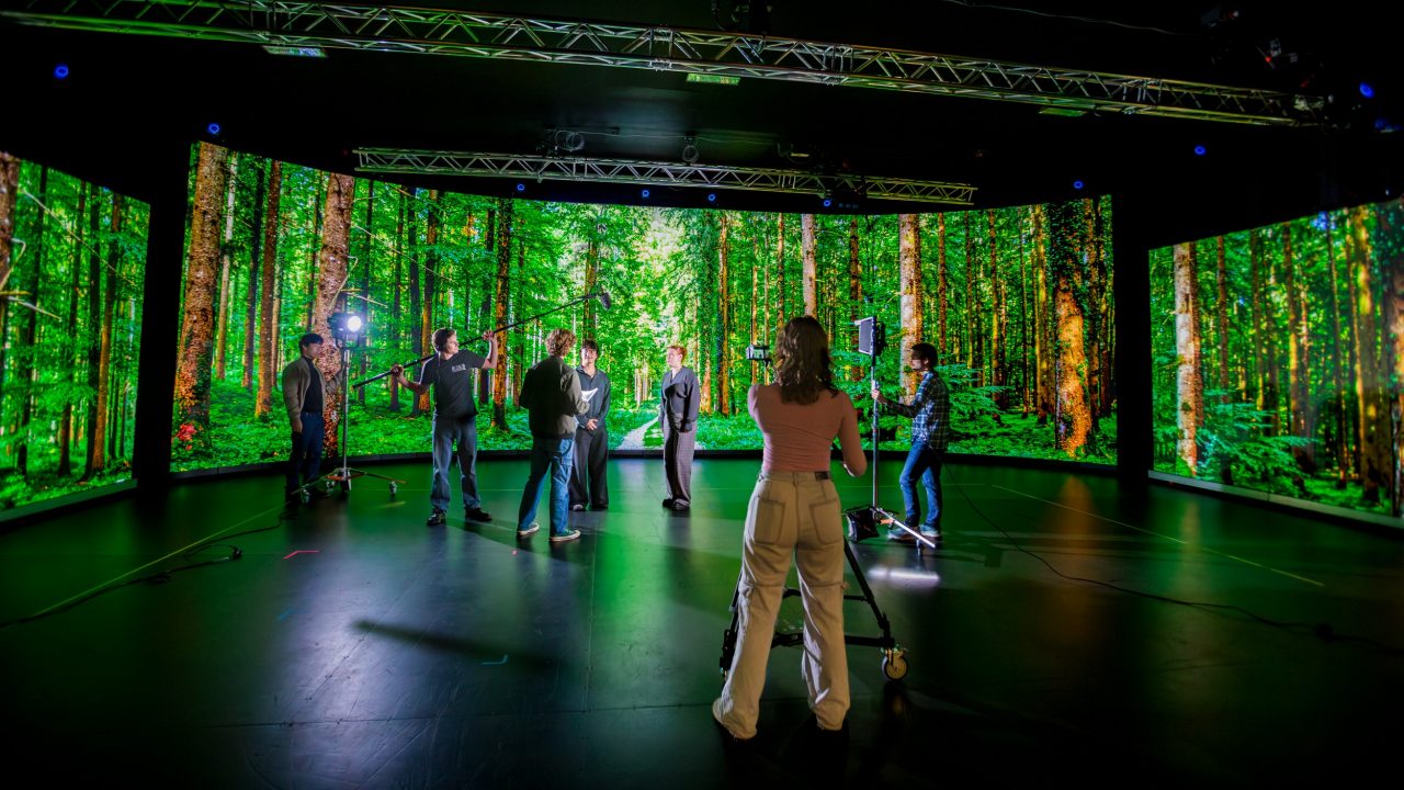 Students in front of the Virtual Screen suite at Kōawa Studios