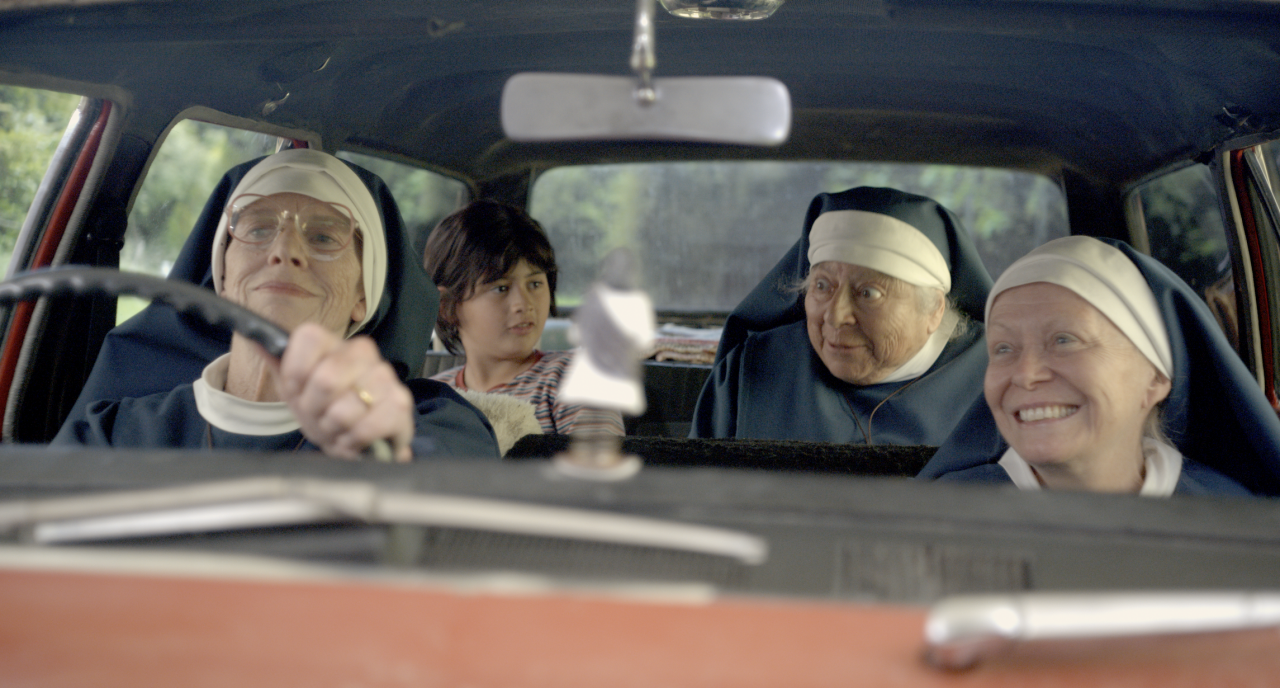 Image of Holy Days actors inside a car